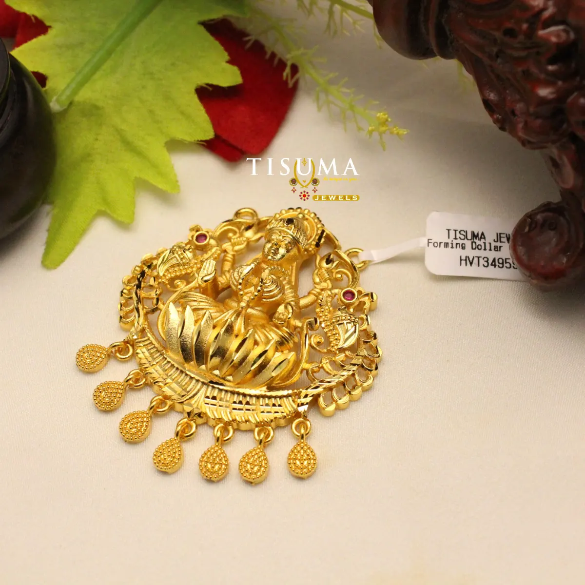 Antique gold Lakshmi forming dollar pendant with red stone accents