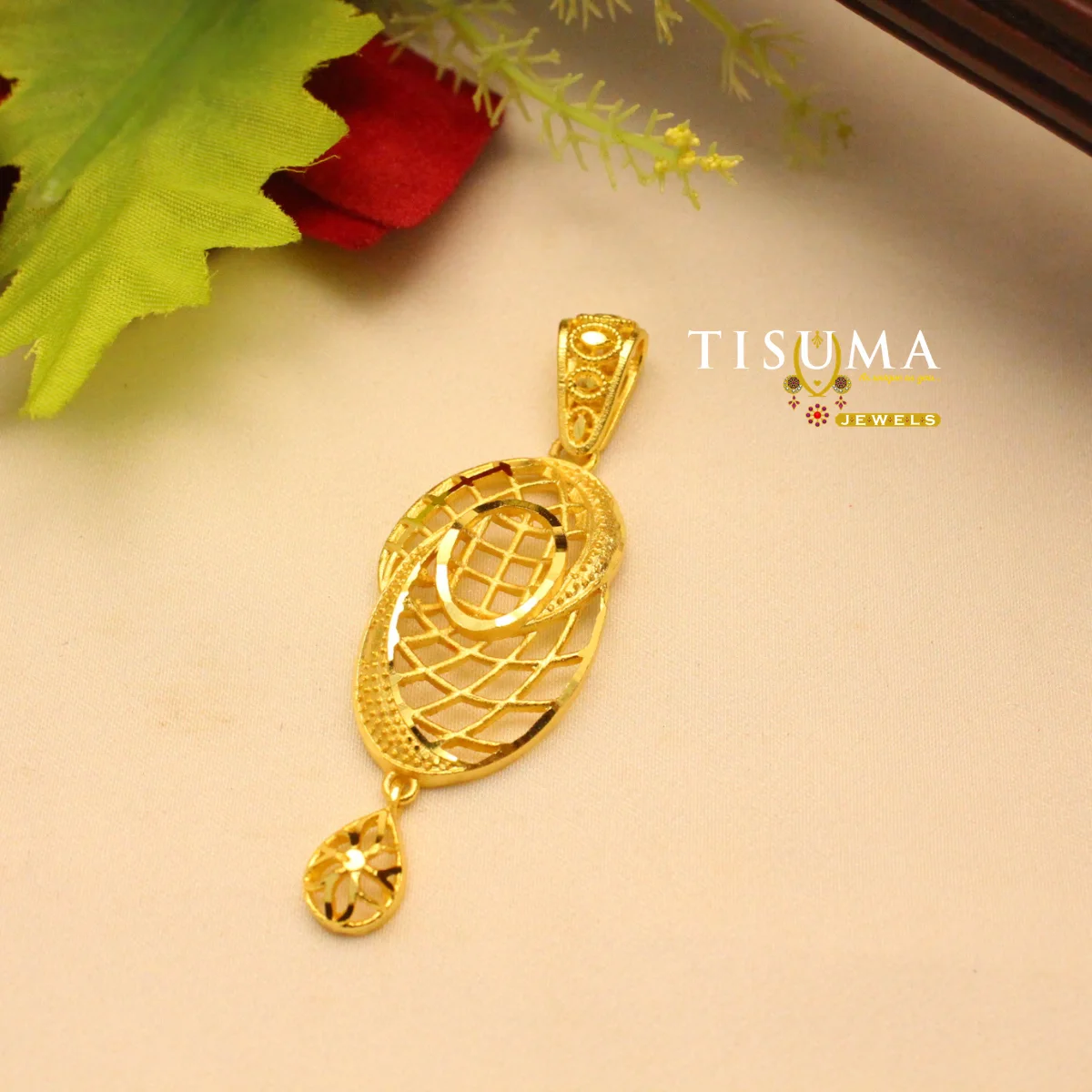 Tisuma Jewels gold finish geometric oval pendant with lattice design and teardrop drop