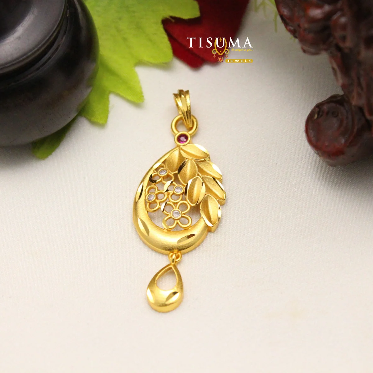 Tisuma Jewels gold finish floral leaf pendant with white stones and teardrop detail