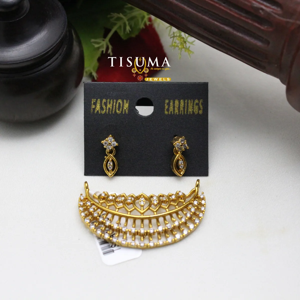 Gold-tone curved choker pendant with clear stones and matching drop earrings