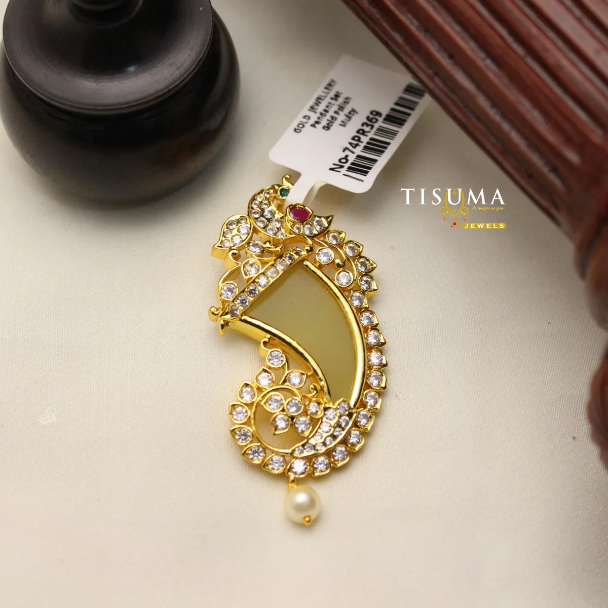 Gold polish peacock-inspired pendant with white stones and pearl drop