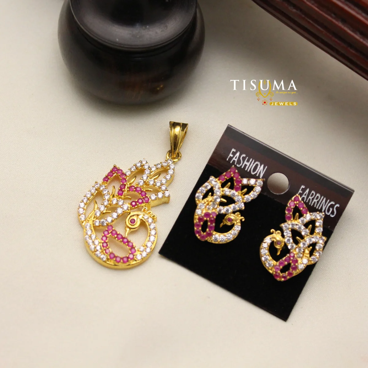 Gold polish peacock pendant and matching earrings with pink and white stones