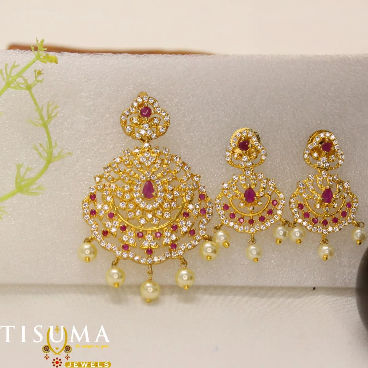 Traditional gold-tone pendant and matching earrings with ruby-red stones and pearl drops