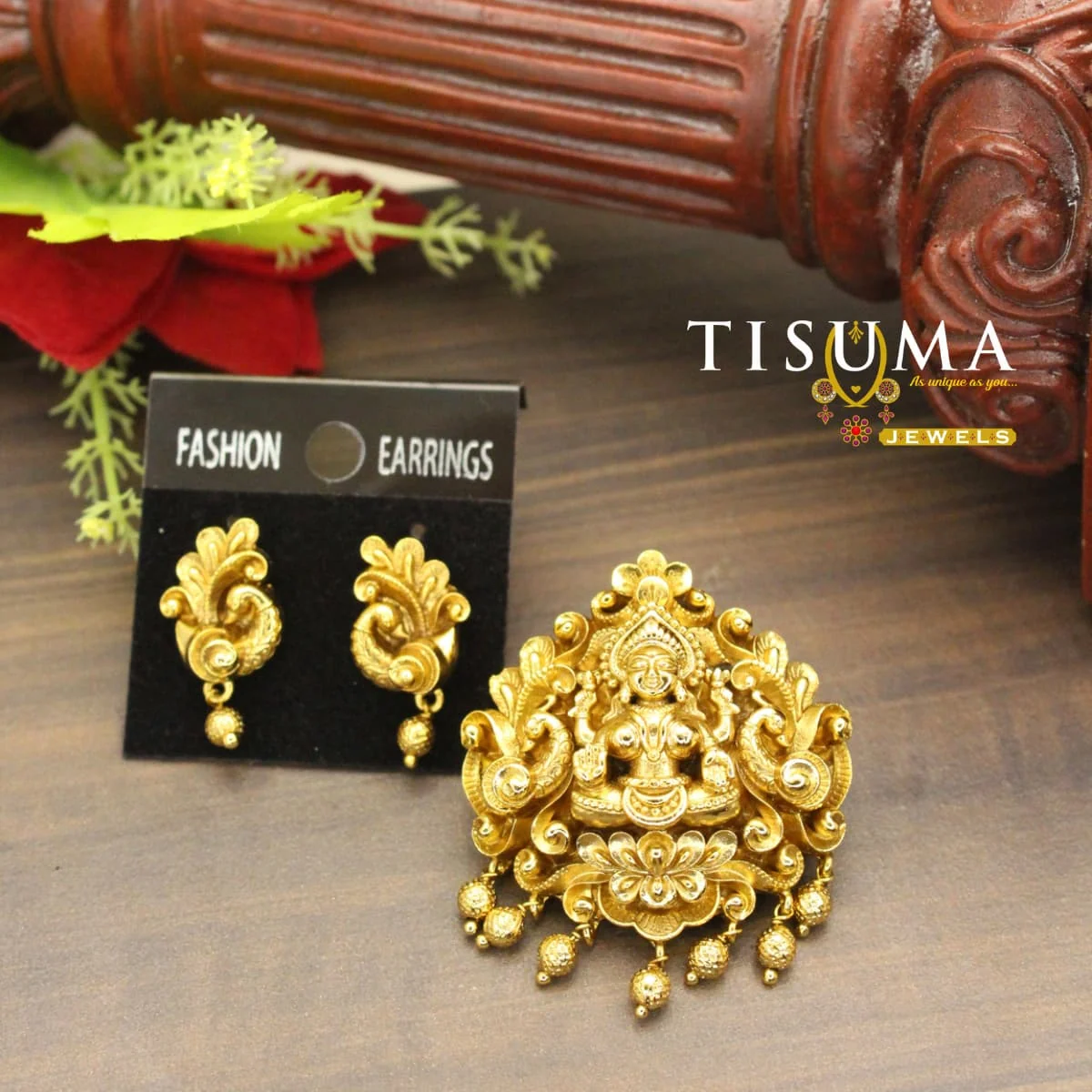 Antique gold-tone Lakshmi pendant with intricate goddess design and matching traditional earrings