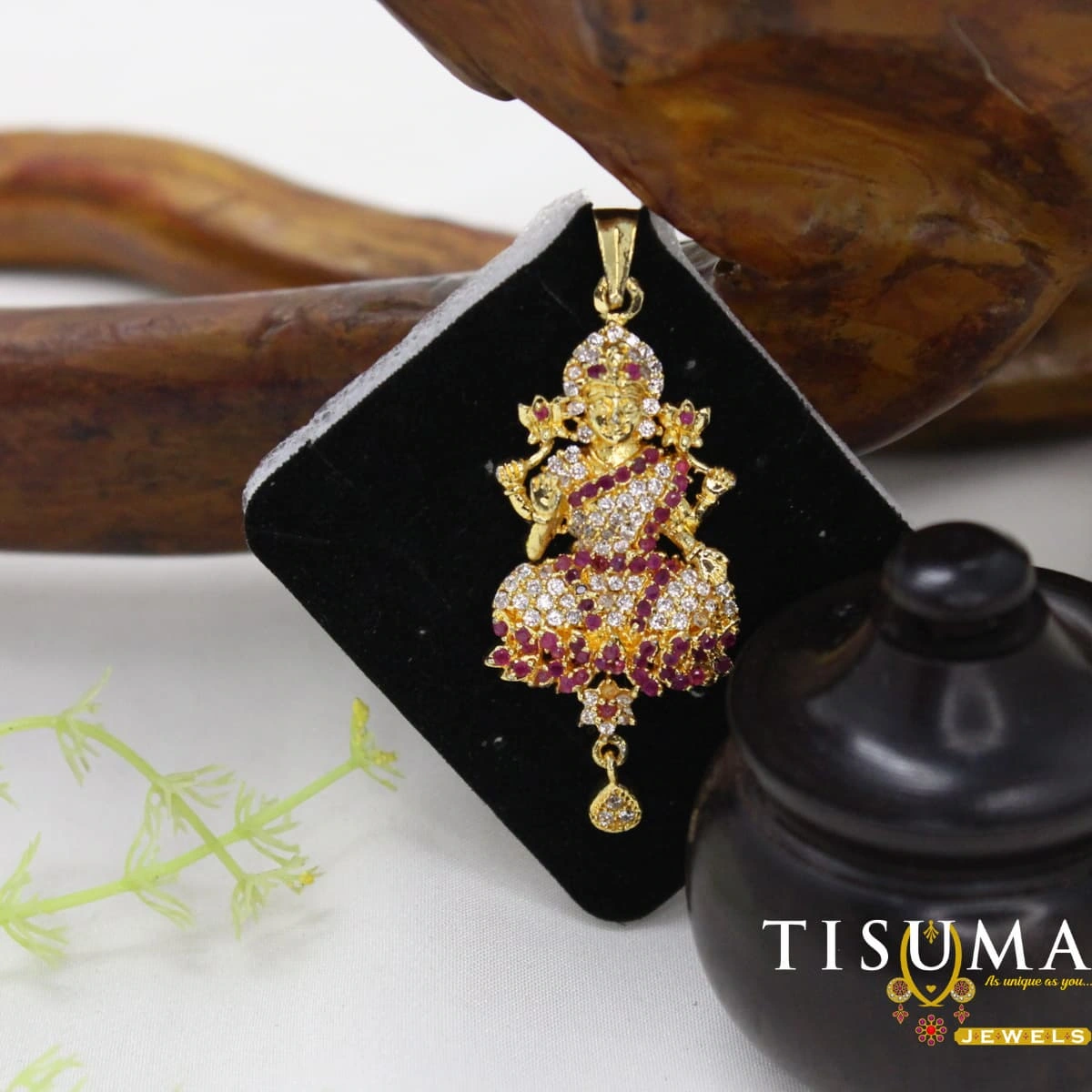 Gold-tone Lord Krishna pendant with ruby-red and clear stone embellishments