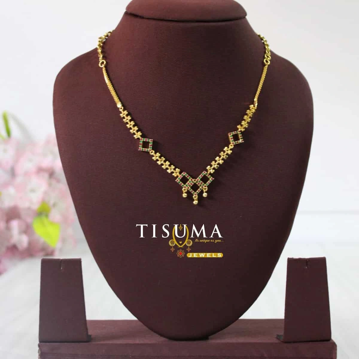One gram gold-tone forming chain with geometric motifs and red and green stones