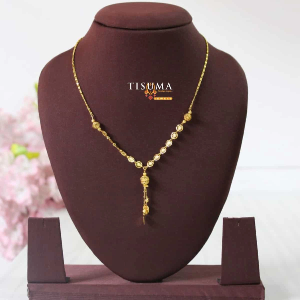 Tisuma Jewels gold-tone forming necklace with oval links and decorative central hanging drop